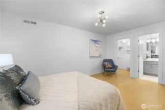 Located near the garage, this spacious bedroom offers comfort and privacy.  A lovely walk-in closet provides ample storage, while the private en-suite bathroom features a walk-in shower for convenience and style.