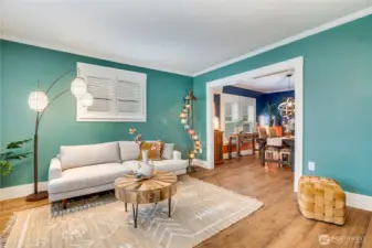 Now that you've had a quick preview, let's tour the whole home beginning in this front living room where updates included flooring, paint, and custom blinds.