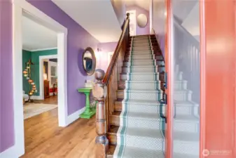 The open staircase is another original feature of the home. Look closely for the brass stair dust corners set into the wall side of each tread. And make sure to pause on clear days for a view of the Olympics up on the landing.