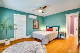 The front bedroom is the larger of the two and features the 2nd mini split unit. The home's compressor allows for 3 units total. Two were installed in 2021 and a 3rd could be added.