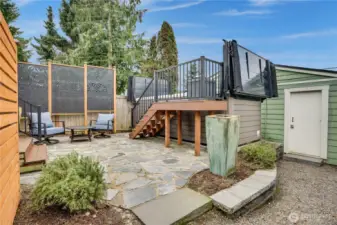 The 16 ft spa is not just a big hot tub. It's an energy-efficient Vita Spa swim spa with a Smart Top, exercise kit, swim tether, 42 hydrotherapy jets, 3 StreamForce stream jets, Bluetooth capability with built-in speakers, a Smart Shield to maximize heat retention, and dual hydraulic lifts for easy opening/closing.