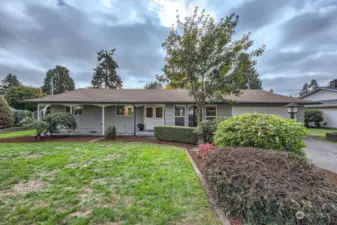 Ever dreamed of a porch swing? Maybe rocking chairs? This covered porch is oversized & great for relaxing, hanging baskets & watching the kids play