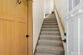 Entry way leading to main living area and garage access.