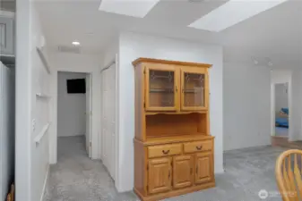 Hallway leads to the primary bedroom and suite