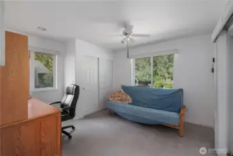 Bedroom 3 is also a great office with slider doors leading to the wrap around deck.