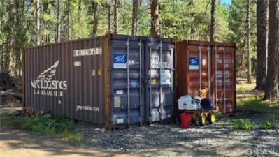 Large shipping containers convey w/sale and provide an abundance of storage.