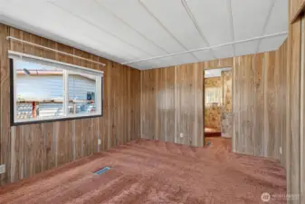 The primary bedroom also opens onto an en-suite primary bathroom.
