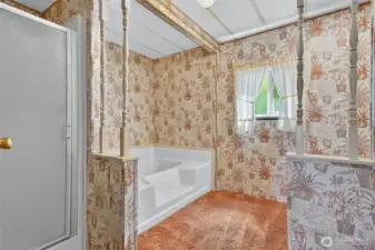 Primary suite has a soaking tub and separate shower.