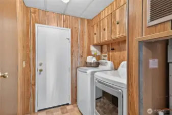 Off the garage entrance is a utility room with washer and dryer that stay with the home.