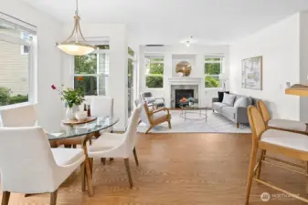Bright and inviting living and dining spaces with cozy fireplace, greenbelt views, and seamless access to your private patio, the true heart of the home.