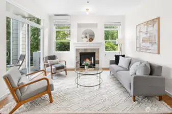 Light-filled family room with cozy fireplace, air conditioning, and sliding doors to the private patio for seamless indoor-outdoor living.