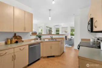 Bright kitchen with stainless steel appliances and generous storage, designed to keep you connected to the living spaces.