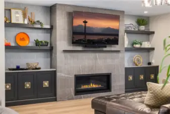 Fireplace and storage area in living space.