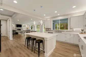 Open-concept flow invites everyone to stay part of the conversation — from cooking to relaxing by the fire.