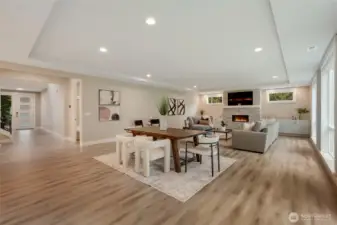 Spacious great room with cozy fireplace and open flow from the kitchen to the outdoors.