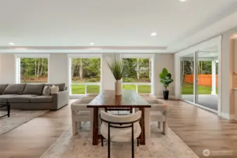 Spacious great room with cozy fireplace and open flow from the kitchen to the outdoors.