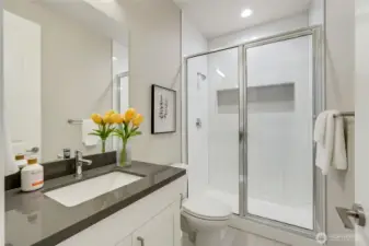 “Main-floor full bath offers convenience for guests, multi-generational living, or a private home office suite.”