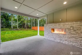 Year-round outdoor living — covered patio + cozy fireplace.  Private backyard oasis backing natural greenspace.