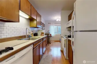 Kitchen has Range/Oven, Refrigerator, Dishwasher, & Microwave