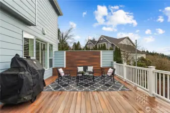Built in seating bench with planters on this privacy wall