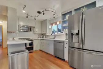 Nice kitchen overlooking rear yard.  All appliances stay!