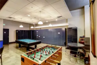 Foosball table, ping pong, pool table large tv, small kitchen & seating.