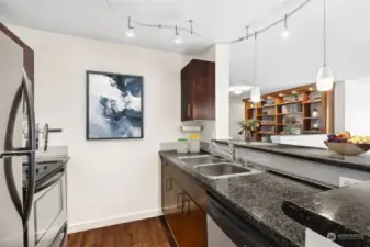 Kitchen features stainless steel appliances & granite counters