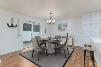 The dinning area is virtually staged showing that there is room a table and chairs for the whole gang.