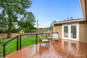 Easily access back deck from living room OR primary bedroom!