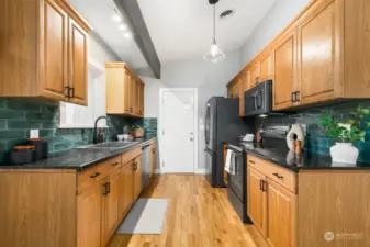 Upgraded appliances + sink, backsplash, light fixtures