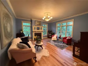 A lovely 2nd living room w/ gorgeous crown molding and beautiful gas fireplace!