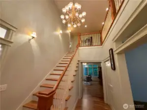 Gorgeous staircase and chandelier leading to 2nd floor!