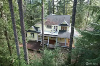 View of the back of the home from lower half of acreage.
