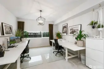 Step inside and prepare to be captivated by an another area of the home that is nothing short of extraordinary. This stunning space has been meticulously designed to create the perfect setting for hosting unforgettable gatherings and lavish soirées. Step into the realm of elegance as you explore this extra finished room, a versatile space that is currently being utilized as a two-person office. From the moment you cross the threshold, you'll be captivated by the sophisticated atmosphere that envelops you. Natural light streams in through the large windows, casting a gentle, flattering glow that enhances the room's graceful ambiance. Elegant curtains frame these windows, offering both privacy and an added touch of luxury. The lighting fixture in this room is a true testament to its elegance. This extra finished room is a testament to the exquisite taste of its current occupants, who have created a space that effortlessly balances functionality and elegance....