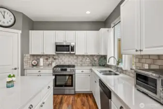 Kitchen is spacious and features a walk-in pantry