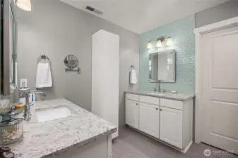 Primary bathroom offers great storage and is inviting