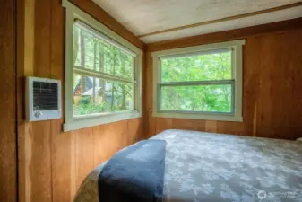 Light & bright windows offer view & sounds of the creek.