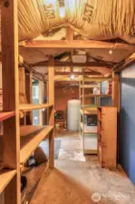 Another fully insulated outbldg houses the water tank & offers additional storage space.