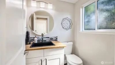 This lower-level half bath ensures comfort and convenience for all.