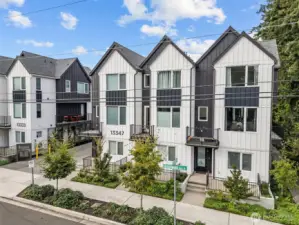 Beautifully designed end-unit townhome with modern curb appeal and a rare 2-car attached garage. The clean contemporary lines, extra windows, and welcoming entry highlight the thoughtful design buyers love in a low-maintenance, move-in ready home.