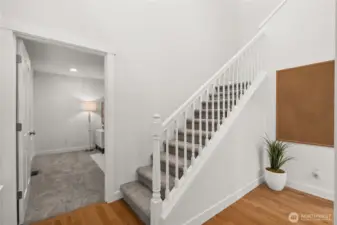 The grand entry opens to a formal living room on the left and office on the right.