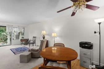 The living room and dining room are divided only by the floor, creating a nice, open feel.