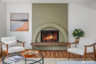 Cozy up to the wood-burning fireplace that has architectural appeal and is a statement piece.