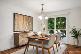 Formal dining room is flooded with natural light and opens out onto upper-level deck overlooking the backyard for outdoor dining options!