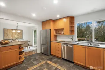 You'll love prepping your meals in the light and bright kitchen while overlooking the lush backyard and green views.