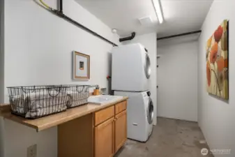 Spacious laundry room with storage space, utility sink!