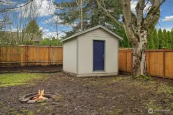 Large shed is an added amenity for storing tools, and gardening supplies!