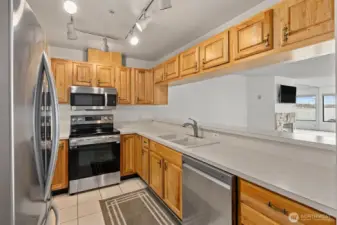 A fresh perspective on the updated kitchen, featuring sleek stainless-steel appliances that are just one year old, combining modern style with everyday functionality.