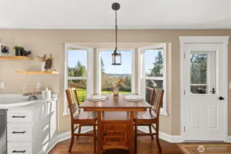 Eating nook off of the kitchen with access to the back deck