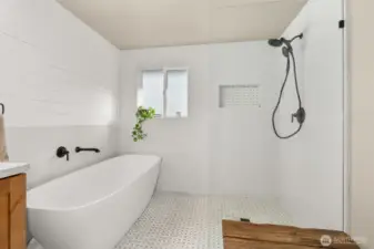 Massive stone soaking tub with a full quartz shower is absolutely stunning!